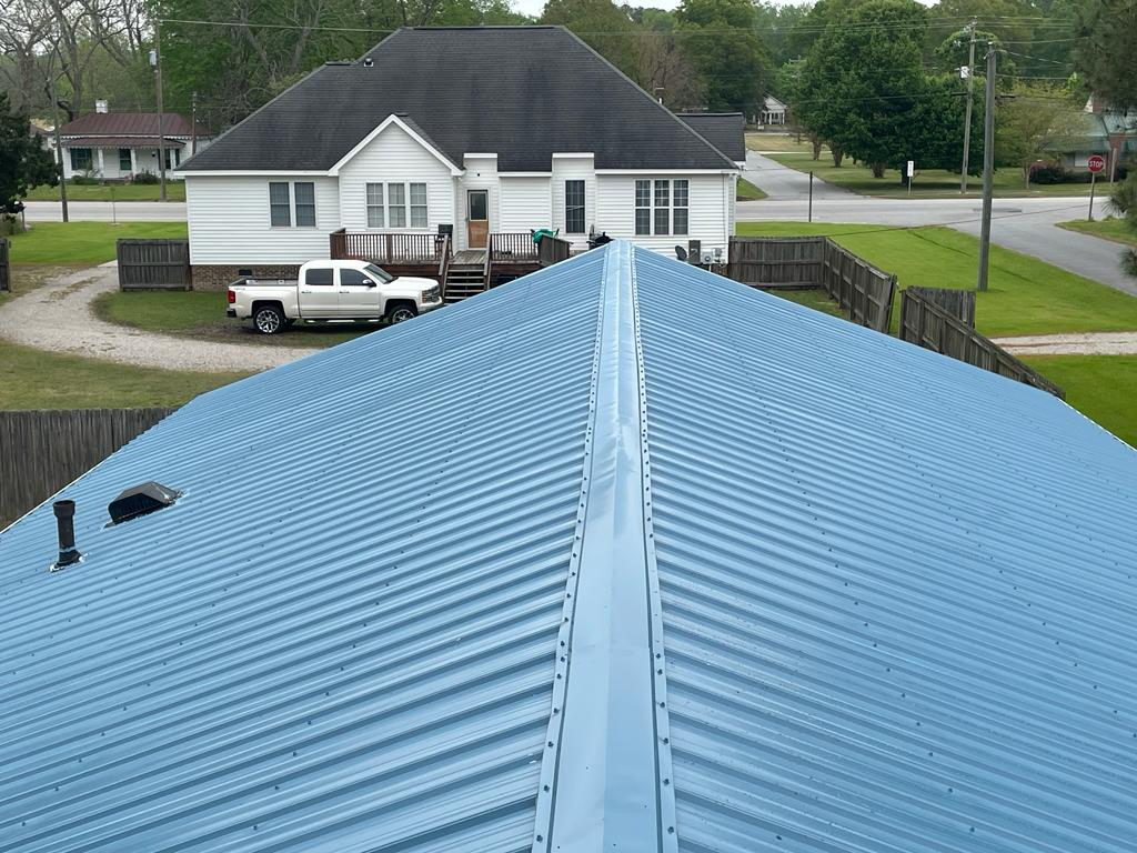 A Home with Perfectly Installed Blue Metal Roof Panels