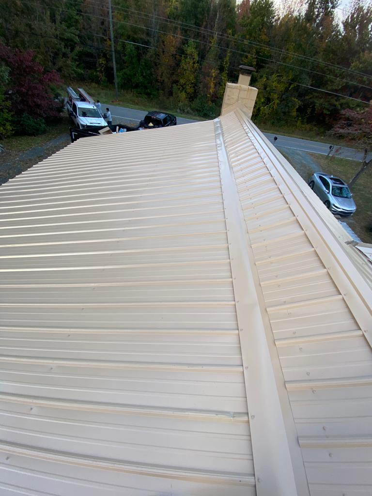 Cream-Colored Metal Roofing Installed by James Kenton