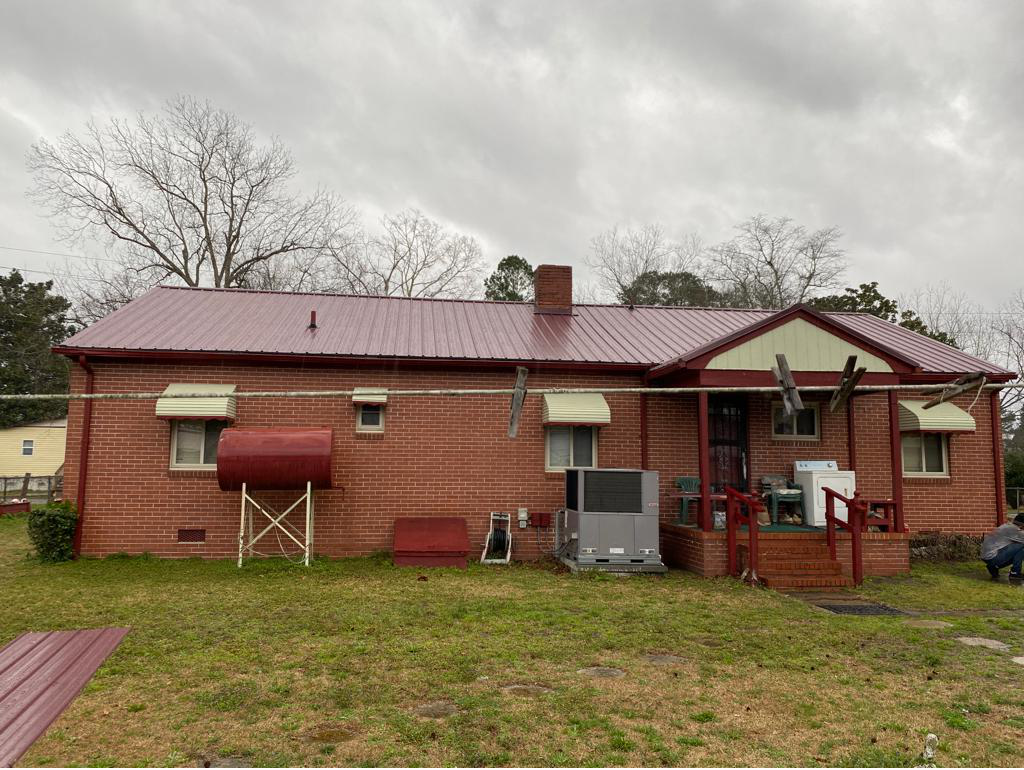 An exterior of a red-colored house